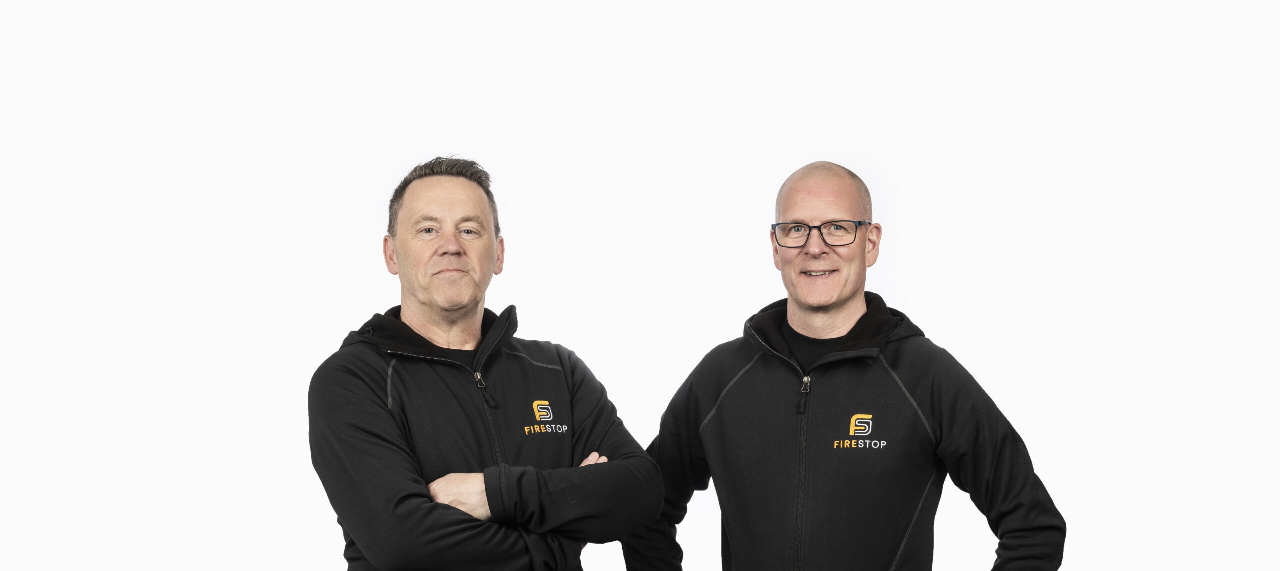 Thomas och Peter på företaget FireStop poserar med vit bakgrund